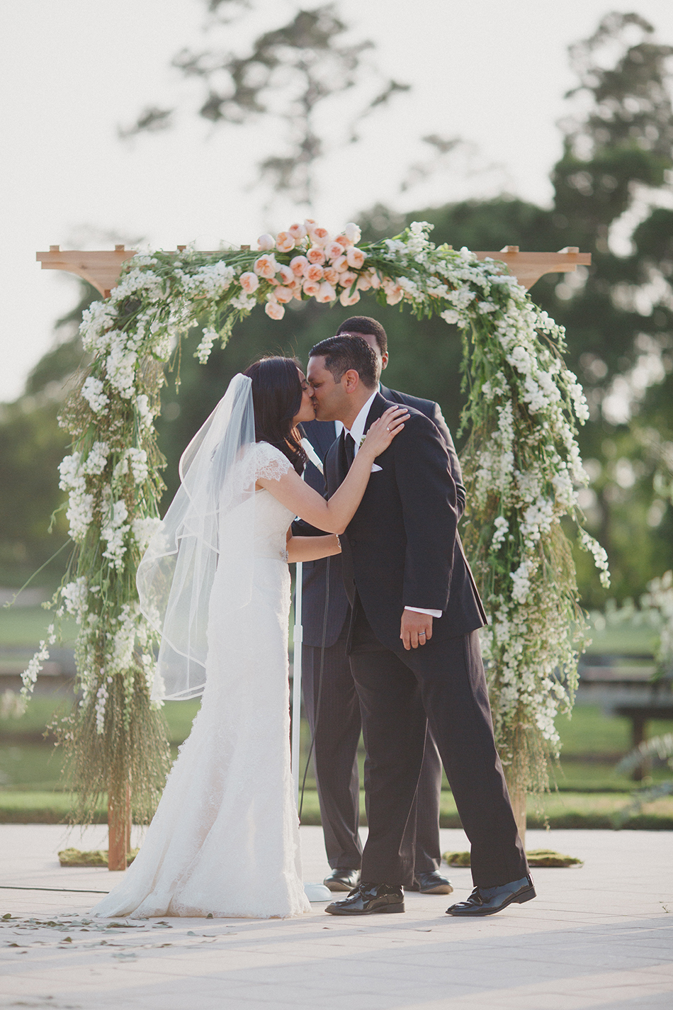 bride and groom first kiss